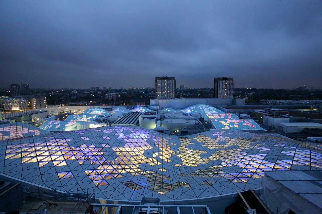 Westfield London roof lit up aerial view